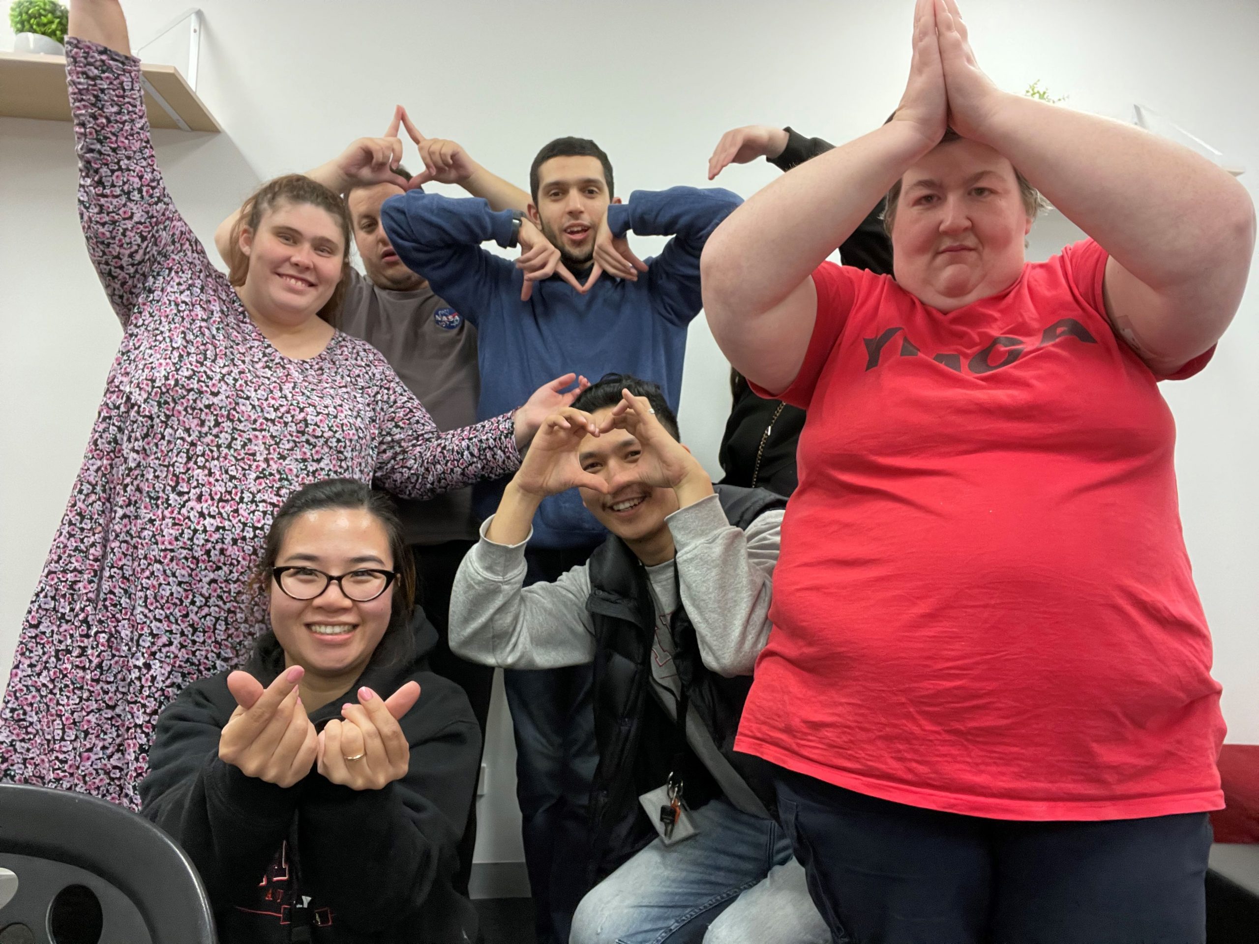 Participants and Staff in fun poses pictured at LA Stars meeting