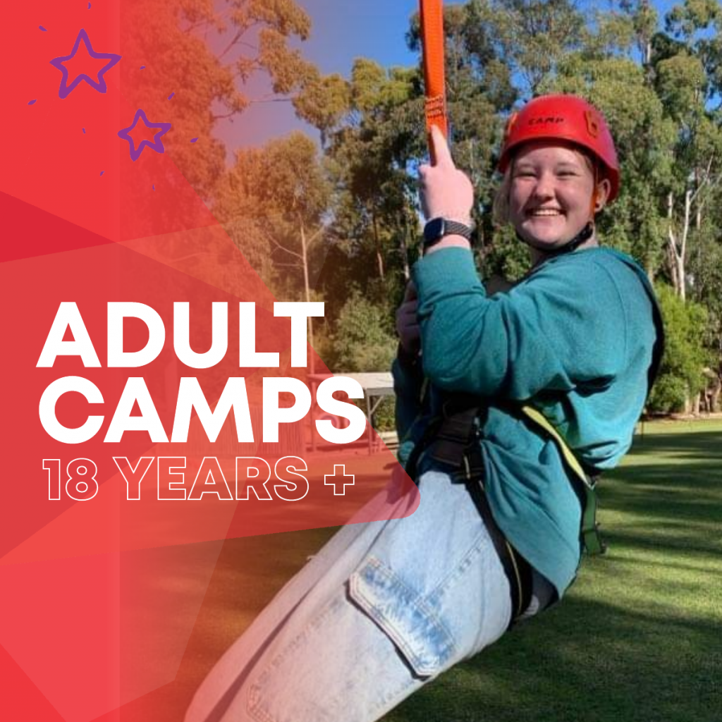 Girl smiling on a giant swing at camp