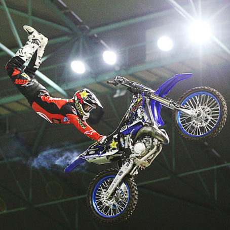 Freestyle Motorcross rider under lights at Arena