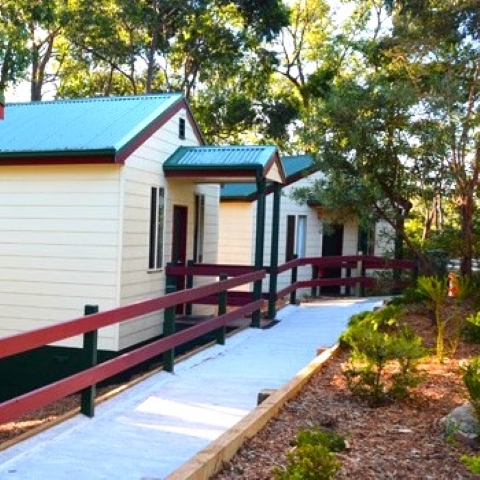 Row of cabins in pleasant bush setting