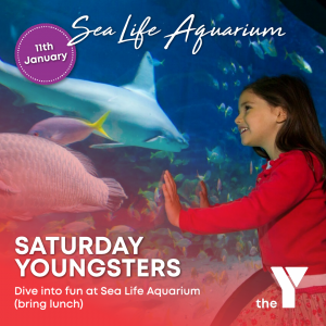 Girl looking at aquarium window